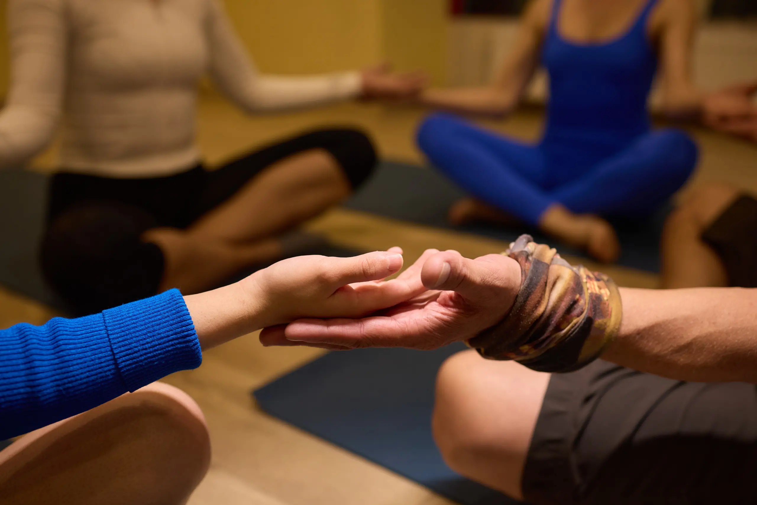 Participants join together in a soothing group meditation session, encouraging deeper connection and mindfulness