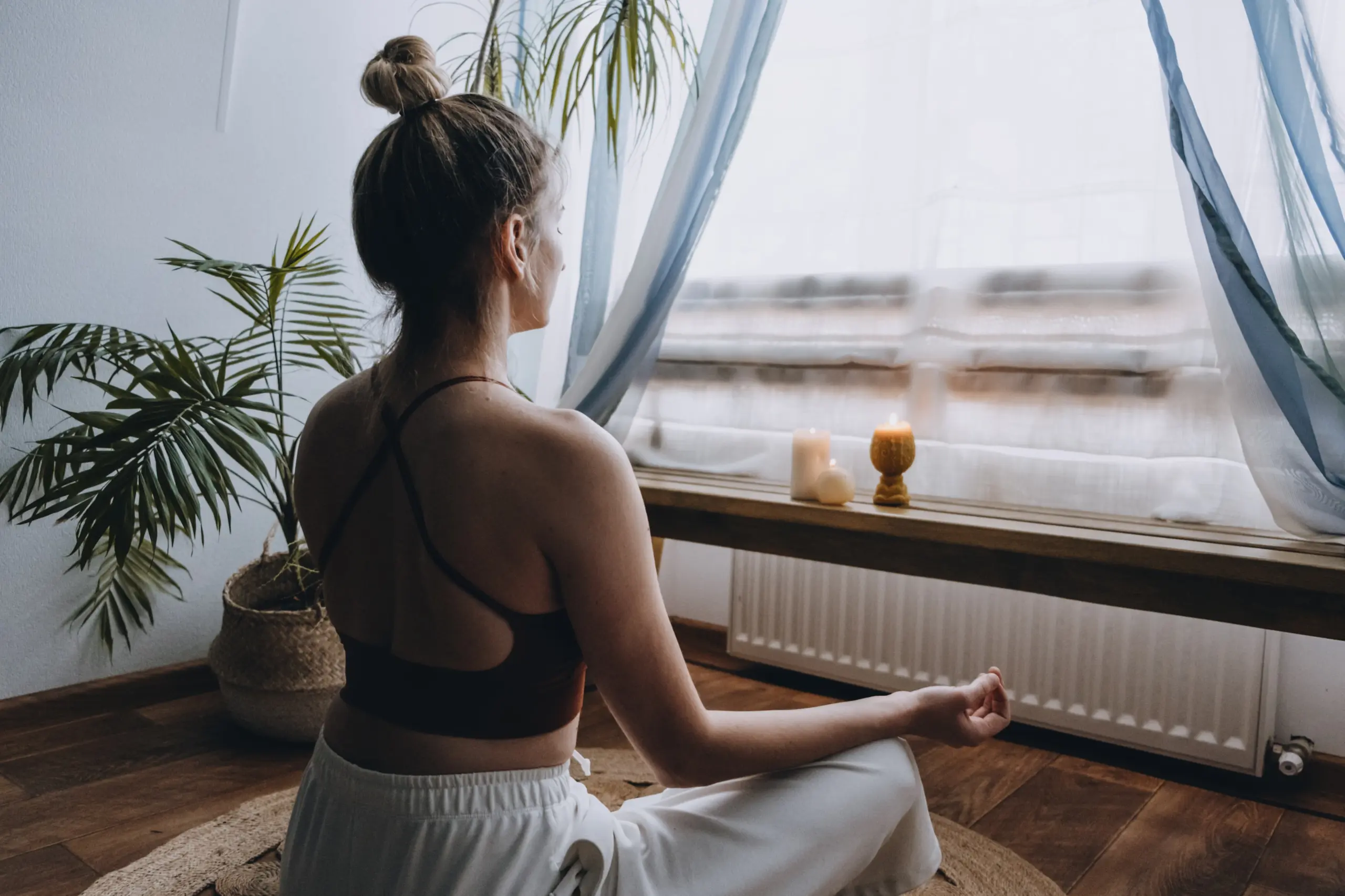 Individual practicing meditation for daily mindfulness during addiction recovery