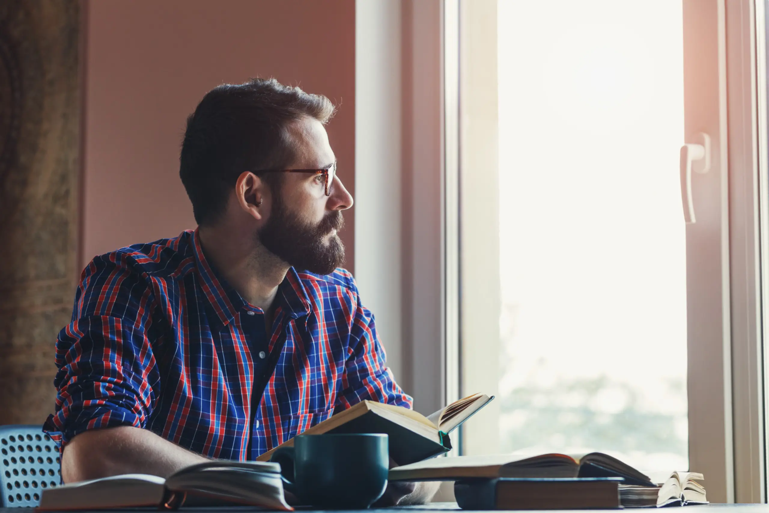 Person journaling during morning routine as part of addiction recovery habit