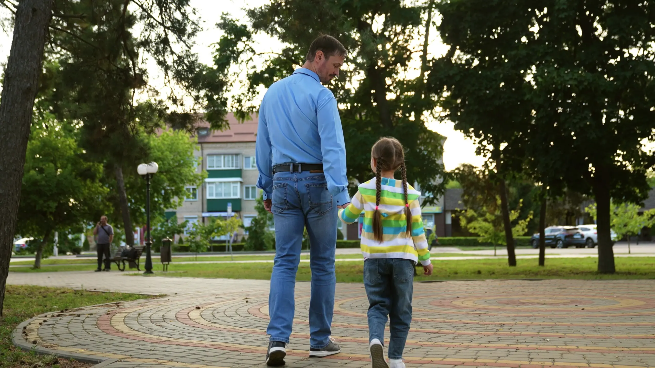 parent discussing addiction recovery with child during a supportive walk